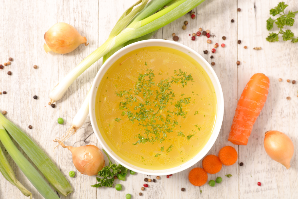 Homemade bone broth in a glass bowl