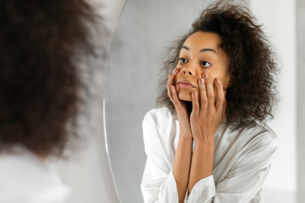 a woman shocked of her dark circles 